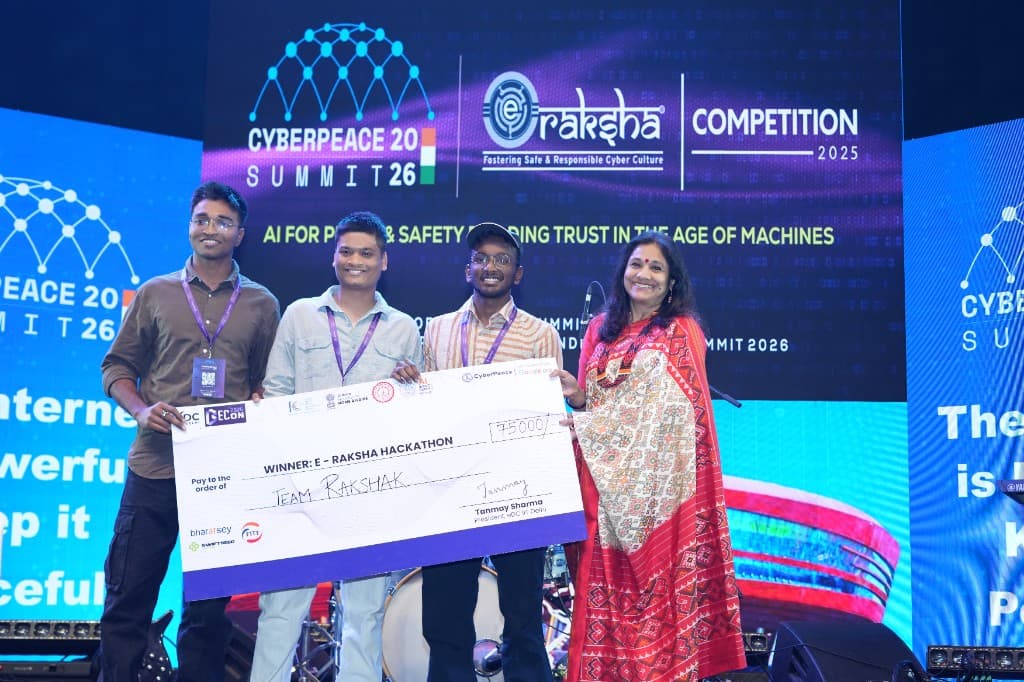 E-Raksha Hackathon winners receiving award at CyberPeace Summit